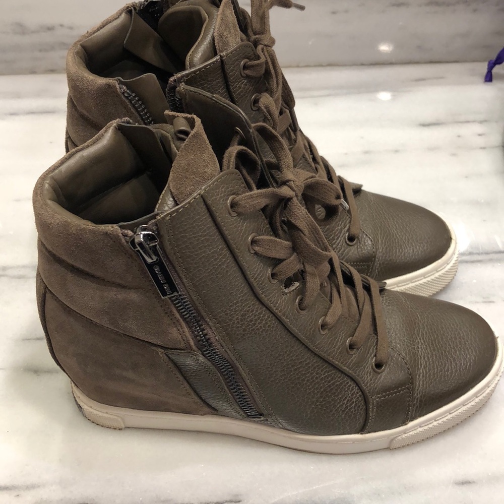 Tennis shoes with a heel, worn once